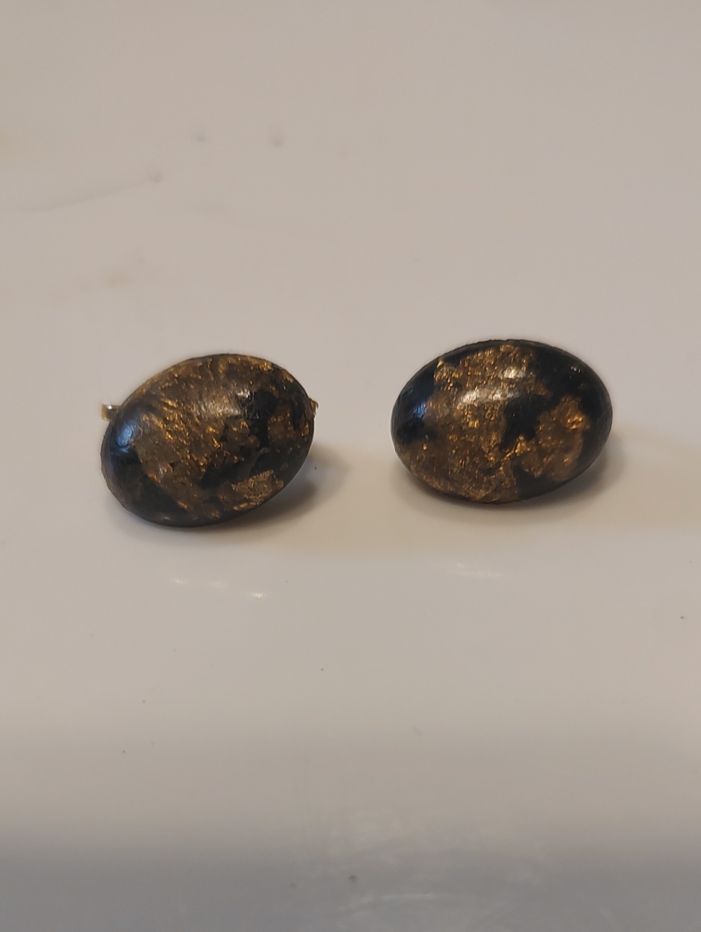 vintage black and gold-tone glass cabochon clip-on earrings